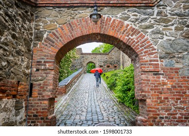 path through an arch made of stone