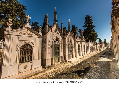 The Path Through The Old Graveyard In Lagos, Portugal. Walking Passed The Crypts And Tombs Towards The Main Gate.