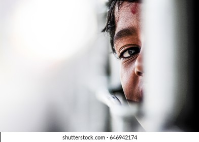 Pathankot, India, september 9, 2010: Indian kid playing hide and seek on a train in India.