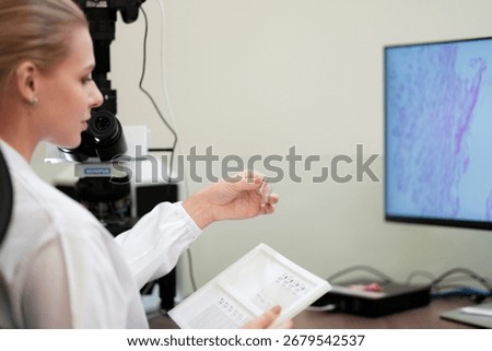 A pathologist performs a quality control check, comparing a physical glass slide with its whole slide image WSI on a digital pathology workstation for a final diagnosis.