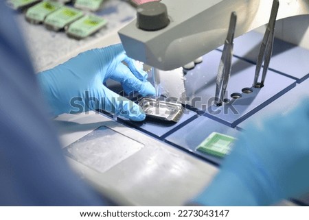 A pathologist is preparing a pathological biopsy for laboratory diagnosis of pathology.