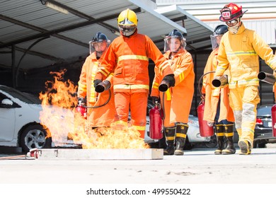 PATHUMTHANI, THAILAND-OCTOBER 14,2016: Many People Preparedness For Fire Drill And Training To Use A Fire Safety Tank In The Factory.