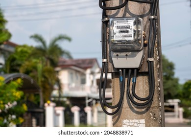 Pathumthani, Thailand-Sep 28, 2021:Electric equipment for measure power usage with a house in the background, kilowatt-hour meter