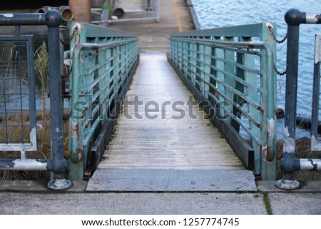 Pathway between docking station and a floating pier, tunnel view.