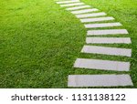 Pathway in the garden outdoor, forward stepping stones or pebbled in the grass lawn. Using for the roadway to success, achievement, leadership, milestone, vision, and mission concept.