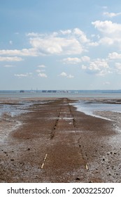 Pathway going out into the sea at Westcliff, Essex, England  on a summer's day - Shutterstock ID 2003225207
