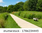 Pathway leading to butterfly garden on a beautiful Summer morning.  Bellevue State Park, Iowa, USA