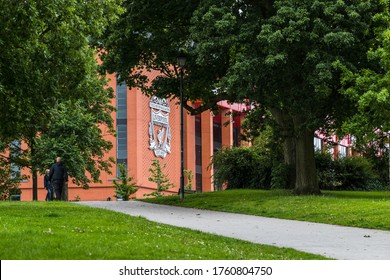 A pathway leads up a hill in Stanley Park in Liverpool (England) to Anfield stadium seen in June 2020.