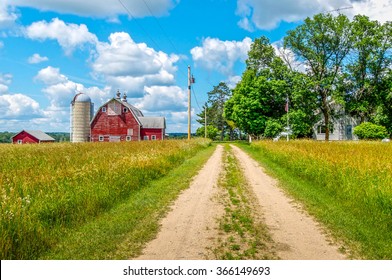 A Pathway Leads To A Small Minnesota Farm.