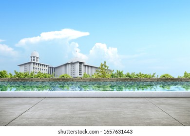 Pathway with pond and mosque view with a blue sky background. Jakarta, Indonesia