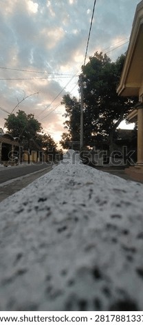 ​A pathway of stone, rugged and raw, points us toward the dawn of memory, where even the lines that connect us must eventually fade into the horizon's timeless glow. (Jombang, September 2020)