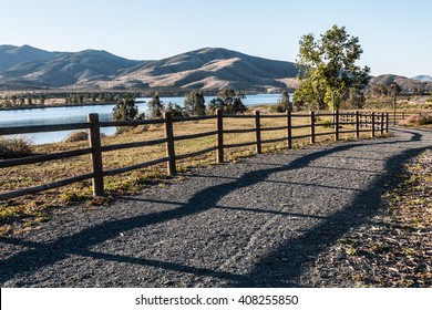 Pathway, trees, lake and mountains at Mountain Hawk Park in Chula Vista, California.  - Shutterstock ID 408255850