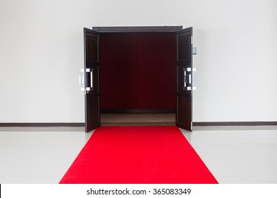 Pathway for triumph with red carpet, leads you to the open door. - Powered by Shutterstock