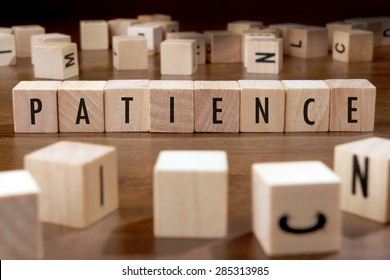 PATIENCE word written on wood block