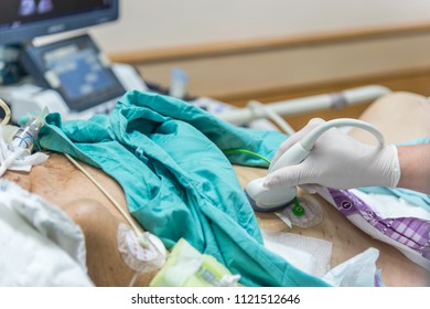 Patient Asian Elder Women 80s Do Abdominal Scan For Diagnosis By Doctor By Use Ultrasound Device On A Elderly Patient Abdomen On Patient Bed In Intensive Care Unit (ICU.) Room At Hospital.