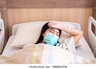 Patient asian women having a headache or migraine severe in hospital,Dengue fever