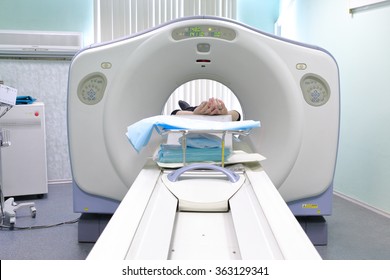 Patient Being Scanned And Diagnosed On CT (computed Tomography) Scanner In Hospital.