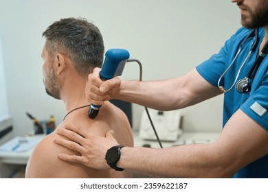 Patient being treated for dorsodynia by physical therapist in clinic - Powered by Shutterstock