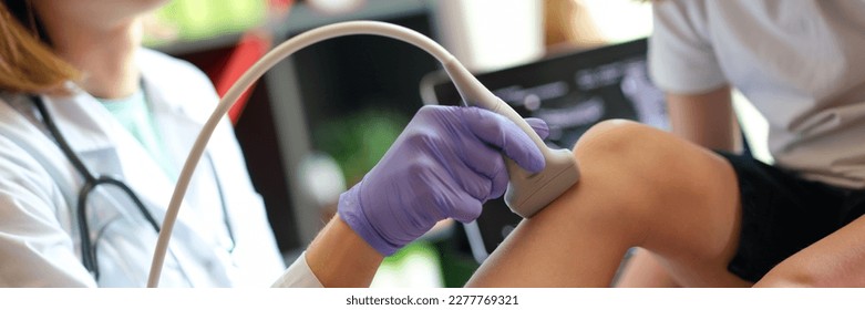 Patient child girl with orthopedic doctor medical ultrasound of knee. Diseases of skeletal system, diseases of joints in children concept - Powered by Shutterstock