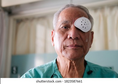 Patient Covering Eye With Protective Shield & Medical Plaster After Eyes Cataract Surgery In Hospital