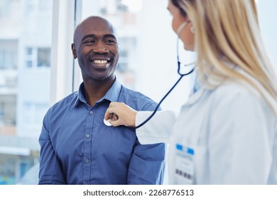 Patient, doctor woman and consultation with stethoscope in hospital for cardiology or health insurance. Black man and healthcare person talking about lungs, breathing and advice for healthy heart - Powered by Shutterstock