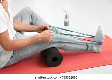 Patient Doing Exercise During Physiotherapy Session In Clinic