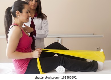 Patient doing some special exercises under supervision of physical therapist