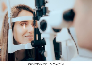 Patient During Eye Examination with the Ophthalmologist in a Clinic. Doctor examining and measuring for proper diagnoses with a binocular slit-lamp
				