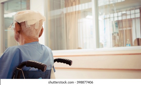 Patient Elderly Man With Head Injury On Wheelchair In Hospital , Process In Vintage Style