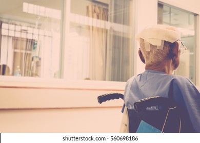 Patient Elderly Man With Head Injury On Wheelchair In Hospital , Process In Vintage Style