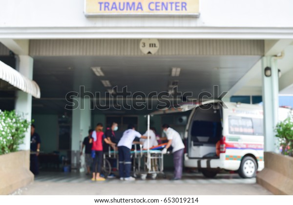 Patient emergency\
with team transfer from ambulance ,Blurry images of patients lying\
in wait in hospital.