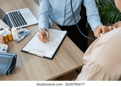 Patient Examination and Health Documentation. A nurse documenting patient information while conducting a health check.