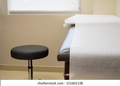 Patient Examination Table In A Doctors Office.