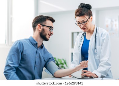 Patient Getting A Blood Pressure Check Up At The Hospital In Doctor's Ward