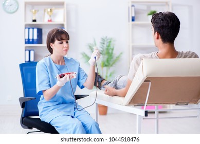 Patient getting blood transfusion in hospital clinic - Shutterstock ID 1044518476