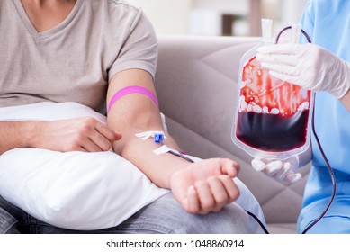 Patient Getting Blood Transfusion In Hospital Clinic