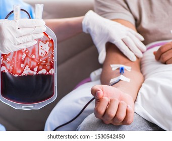 Patient Getting Blood Transfusion In Hospital Clinic