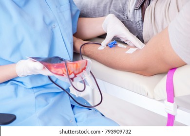 Patient Getting Blood Transfusion In Hospital Clinic