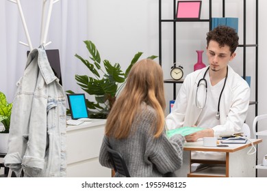 The Patient Gives The Medical Records To Her Primary Care Physician. Doctor's Office