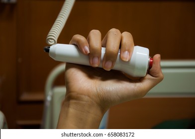 Patient hand press helping button nurse call for emergency in the hospital. ward
