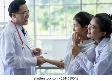 Patient has afraid and scary of syringe and needle. - Shutterstock ID 1344039341