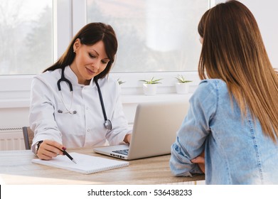 Patient Having Consultation With Doctor In Office