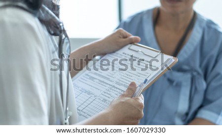 Patient health insurance claim form in doctor or nurse hands for medicare coverage and medical treatment from illness, accident injury and admitted in hospital ward