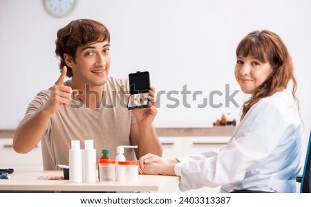 Similar – Image, Stock Photo Woman applying hearing aid to ear