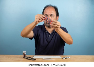 Patient Holds The Blister Card Of The Medication He Should Take.