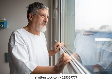 Patient At A Hospital, Looking From A Window In His Room, Doing Much Better After The Surgery