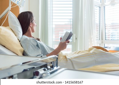 Patient In Hospital Room Looking Out Of The Window From Bed Hoping For Quick Recovery