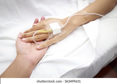 Patient In Hospital With Saline Intravenous (iv)