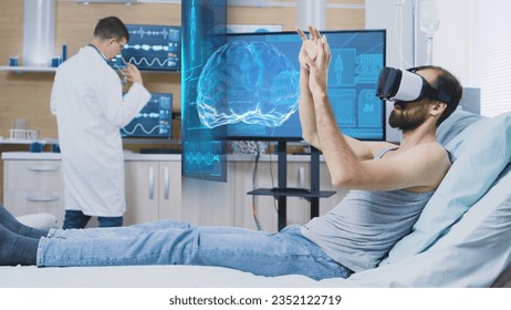 Patient laying in clinic bed wearing virtual reality headset while scientist monitors his brainwaves on screen, using medical device to enhance understanding of human mind and contribute to research - Powered by Shutterstock