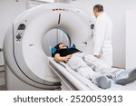 The patient lies inside an MRI or CT machine where the scan is performed. This high-tech equipment represents an innovation in diagnostics, providing accurate information for effective treatment.